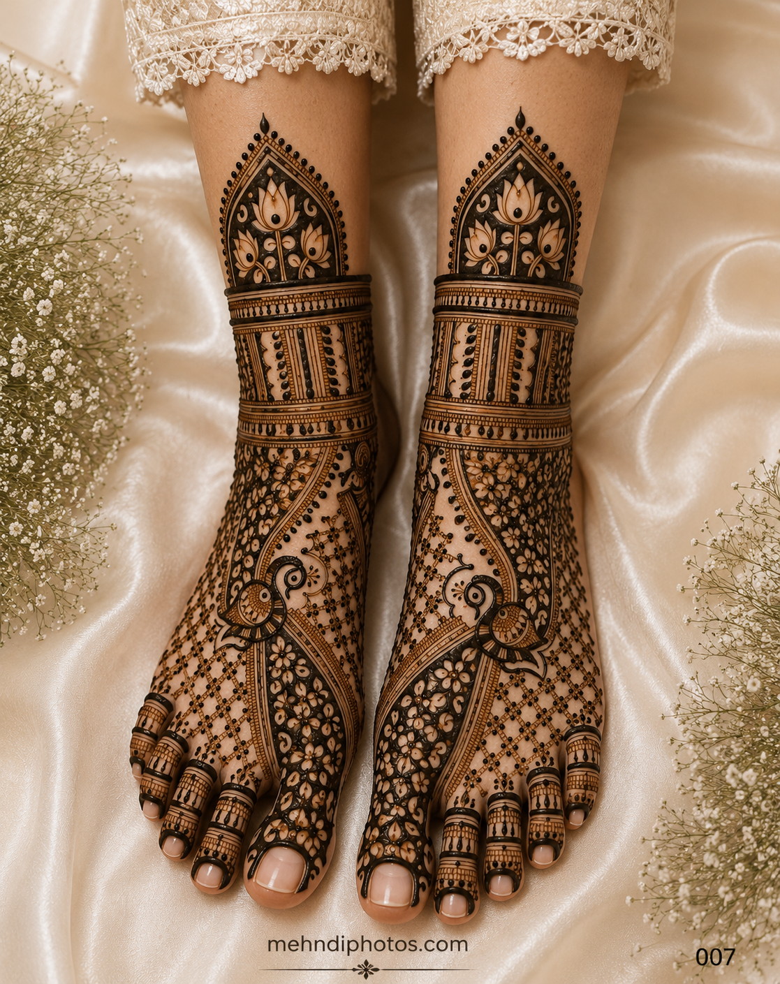 Bridal foot mehndi design on both feet featuring peacock motifs, lotus arch patterns, floral jaali work, ornamental ankle bands and decorated toes.