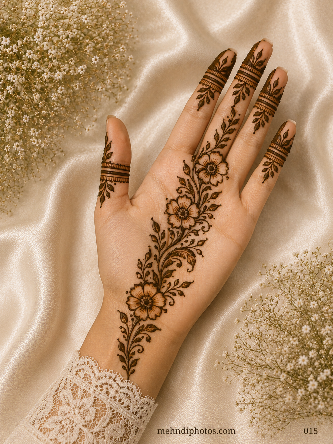 Simple front hand mehndi design with three shaded flowers, a diagonal leafy vine, delicate curls and minimal patterns on all fingers.