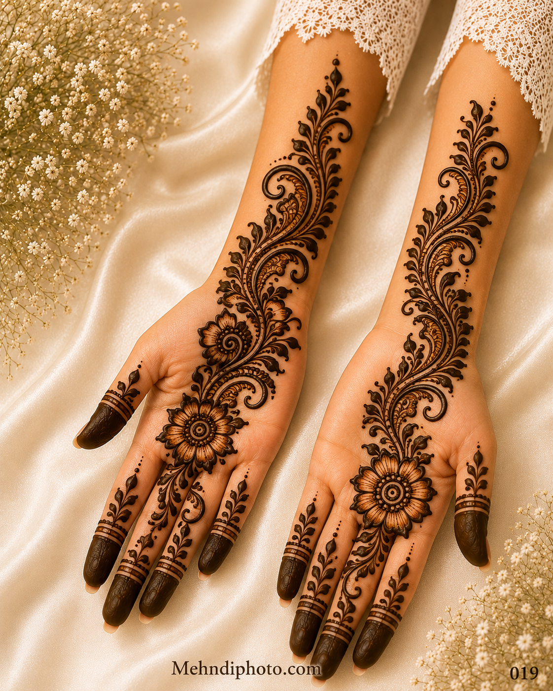 Elegant floral vine front hand mehndi design with bold flower, leafy vine, and paisley pattern extending from palm to forearm for girls and women.