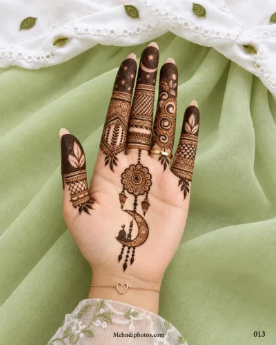 Muslim front hand mehndi design featuring a crescent moon with a mosque, hanging floral medallion, leafy details, and patterned fingers.