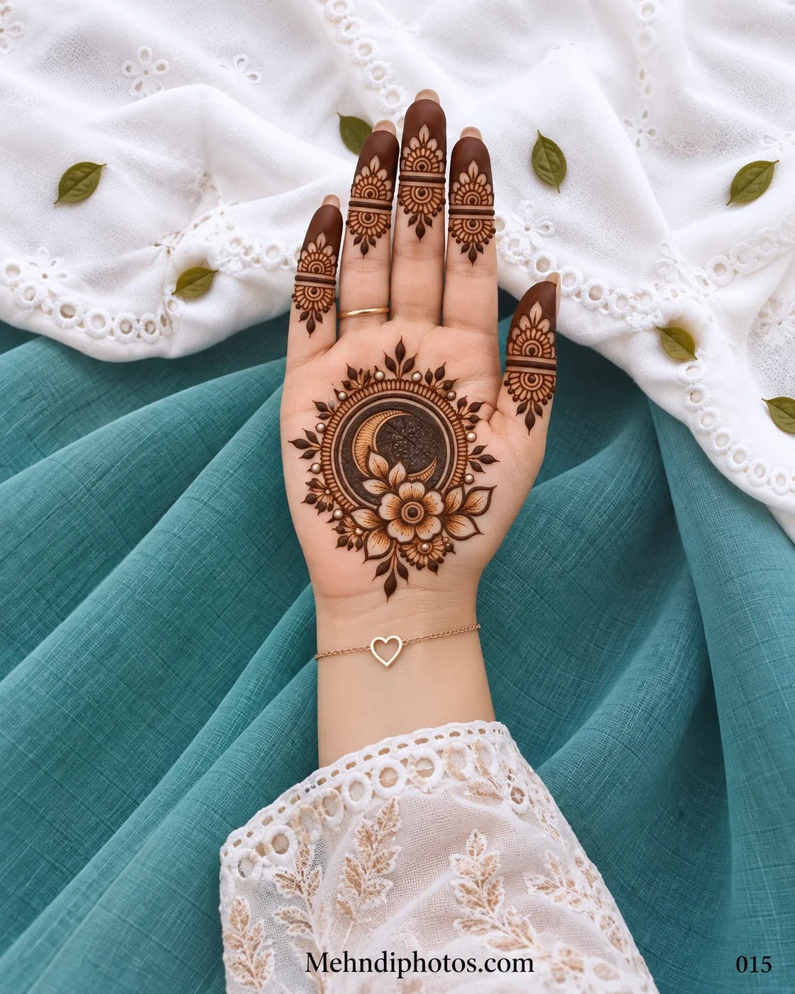 Front hand with floral gol tikki, leafy border, and shaded finger panels