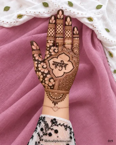 Diwali front hand mehndi design featuring Mahotsav in Hindi calligraphy, floral negative space, circular lacework, netted fingers, and a hanging wrist mandala.