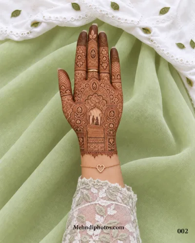 Front hand with an intricate Muslim bridal mehndi design featuring a bride and groom beneath an arch, floral motifs and detailed finger patterns.