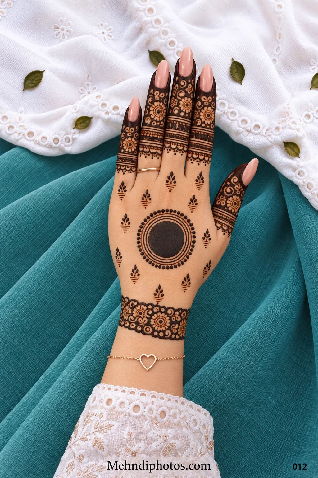 Back hand with ringed gol tikki, floral finger caps, and wrist cuff