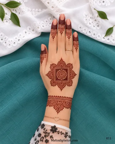 Back hand with square floral mandala, shaded fingers, and lace wrist cuff