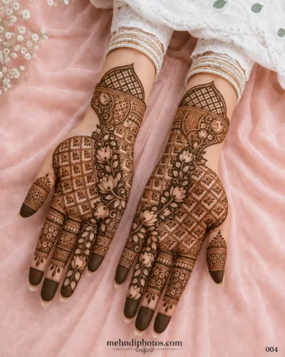 Intricate floral lattice mehndi design with geometric patterns on both hands