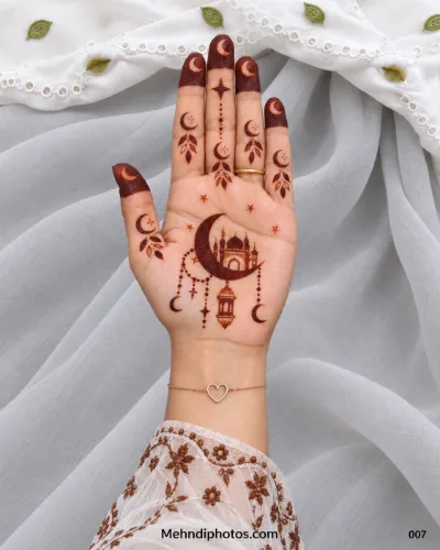 Eid front hand mehndi featuring a mosque inside a crescent moon with hanging lanterns, stars, leafy accents, and decorated fingertips.