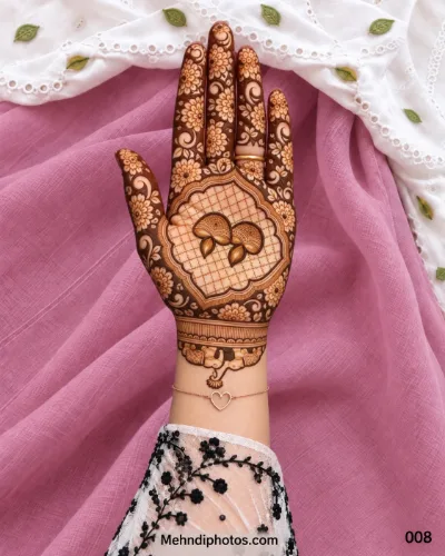 Diwali front hand mehndi design with paired paisley motifs, a scalloped lattice frame, dark floral fingers, swirling leaves, and elephants near the wrist.