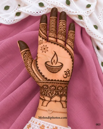 Diwali front hand mehndi design featuring a diya and Om symbol, geometric finger patterns, dark fingertips, sunbursts, and a lotus wrist motif.